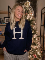 Load image into Gallery viewer, Navy crewneck sweatshirt with large natural colored &quot;H&quot; on the front center.
