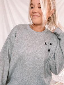 Charcoal Gray sweatshirt with 3 black embroidered stars on the left chest.
